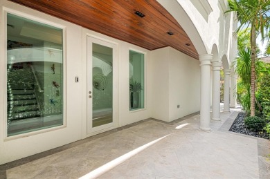 Experience luxury waterfront living in this impeccably