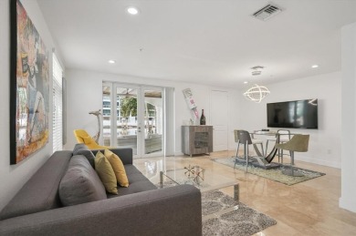 Experience luxury waterfront living in this impeccably