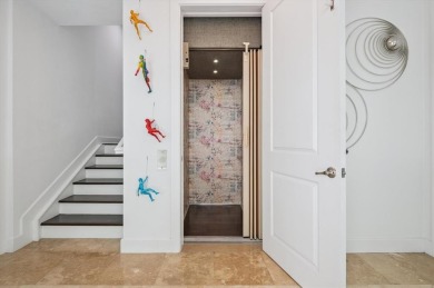 Experience luxury waterfront living in this impeccably