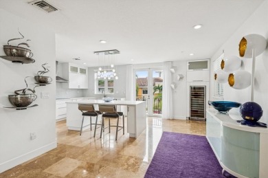 Experience luxury waterfront living in this impeccably