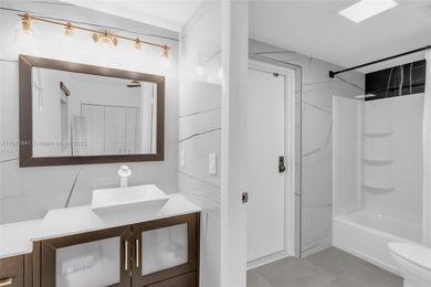 Live on a private, guarded island in Sunny Isles at Poinciana