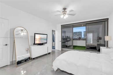 Live on a private, guarded island in Sunny Isles at Poinciana