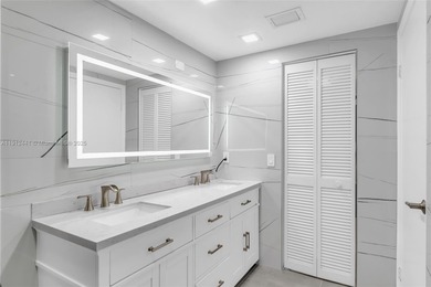 Live on a private, guarded island in Sunny Isles at Poinciana