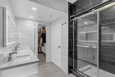 Live on a private, guarded island in Sunny Isles at Poinciana