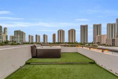 Live on a private, guarded island in Sunny Isles at Poinciana