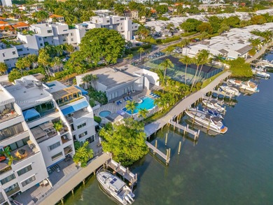 Live on a private, guarded island in Sunny Isles at Poinciana