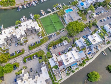 Live on a private, guarded island in Sunny Isles at Poinciana