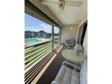 Serene 55+ community of Regal Palms! This third-floor unit