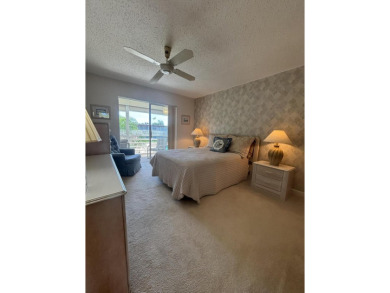 Serene 55+ community of Regal Palms! This third-floor unit