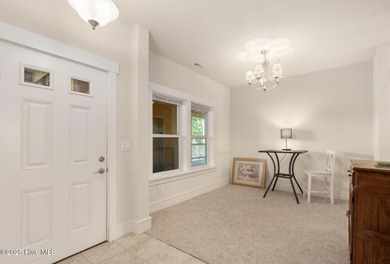 Welcome to Villas at Waterside Unit 100B, a meticulously