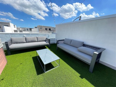 LUXURY LANDMARK DORAL, THIS STUNNING 4-STORY TOWNHOUSE! BOASTING