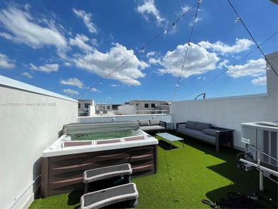 LUXURY LANDMARK DORAL, THIS STUNNING 4-STORY TOWNHOUSE! BOASTING