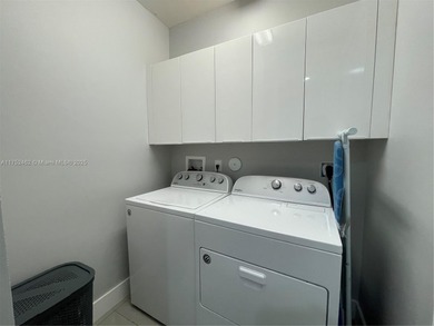 LUXURY LANDMARK DORAL, THIS STUNNING 4-STORY TOWNHOUSE! BOASTING