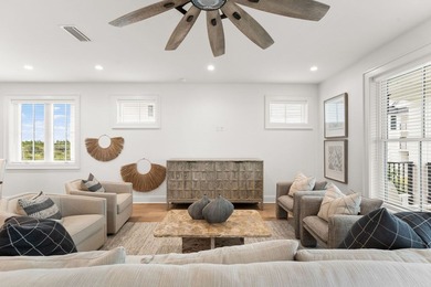 Introducing a striking four-level coastal haven that rises above