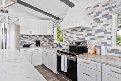 Welcome to your fully renovated lakefront retreat on beautiful