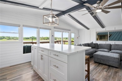 Welcome to your fully renovated lakefront retreat on beautiful