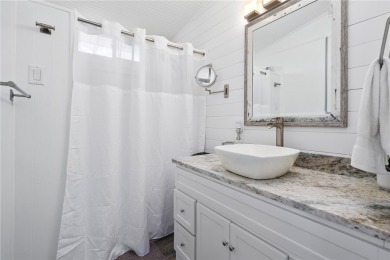 Welcome to your fully renovated lakefront retreat on beautiful