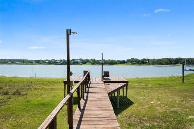 Welcome to your fully renovated lakefront retreat on beautiful