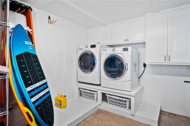 Welcome to your fully renovated lakefront retreat on beautiful