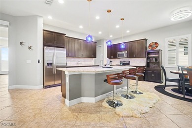 Welcome to this beautifully designed WCI-built 4-bedroom, 3-bath