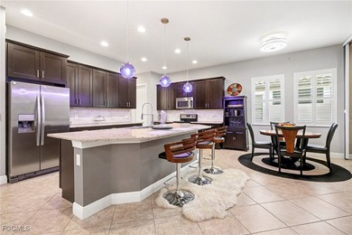 Welcome to this beautifully designed WCI-built 4-bedroom, 3-bath