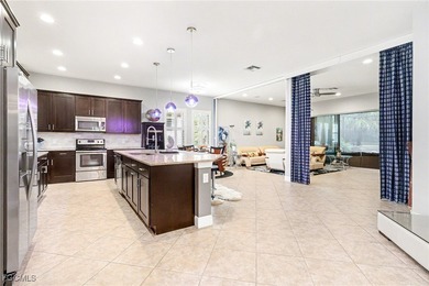 Welcome to this beautifully designed WCI-built 4-bedroom, 3-bath