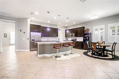 Welcome to this beautifully designed WCI-built 4-bedroom, 3-bath