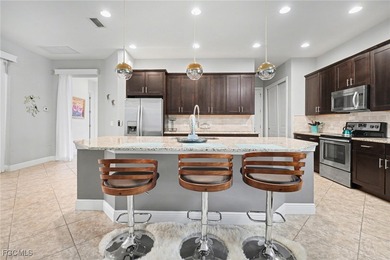 Welcome to this beautifully designed WCI-built 4-bedroom, 3-bath