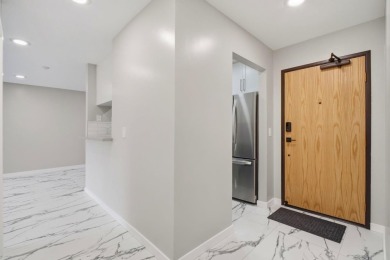 Welcome to this beautifully remodeled, high-end ground-floor