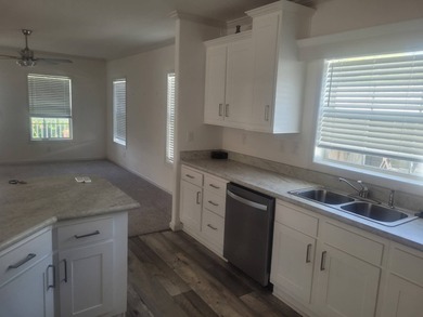 Welcome to Florida living at its finest in this almost-new