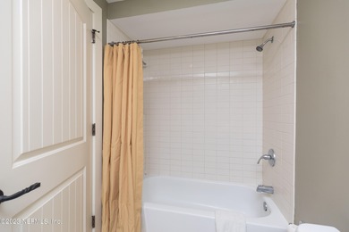 Fully furnished luxury condo with higher vaulted ceilings and