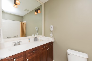 Fully furnished luxury condo with higher vaulted ceilings and