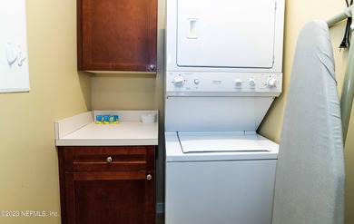 Fully furnished luxury condo with higher vaulted ceilings and