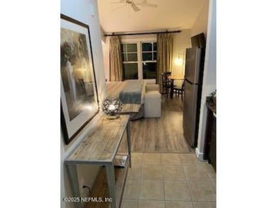 Fully furnished luxury condo with higher vaulted ceilings and