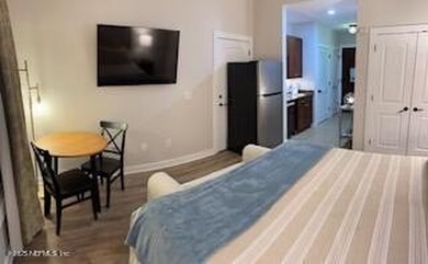 Fully furnished luxury condo with higher vaulted ceilings and