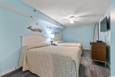 Step right onto the sand from this desirable first-floor, direct