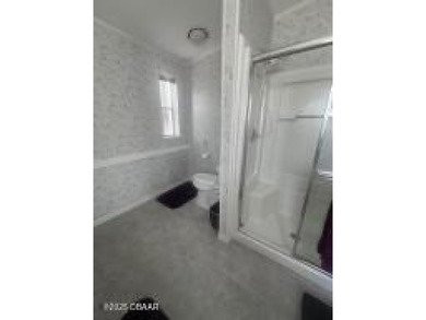 This immaculate home in a 55-plus community is move-in ready and