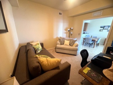 *FURNISHED END UNIT plus a DEN with WATER & GOLF COURSE VIEWS!