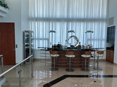 Located in the private, gated enclave of Esplanade on the Bay