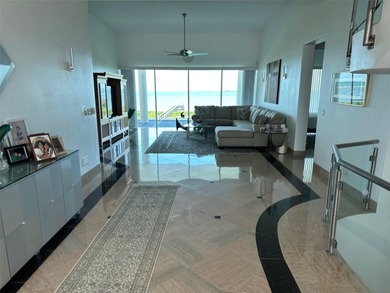 Located in the private, gated enclave of Esplanade on the Bay