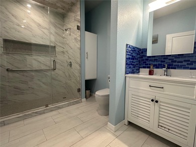 Located in the private, gated enclave of Esplanade on the Bay