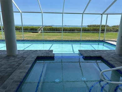 Located in the private, gated enclave of Esplanade on the Bay