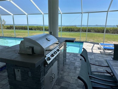 Located in the private, gated enclave of Esplanade on the Bay