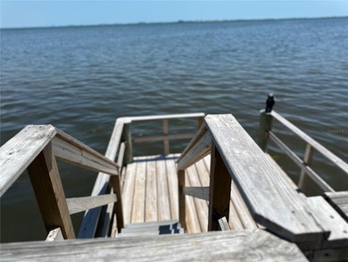 Located in the private, gated enclave of Esplanade on the Bay