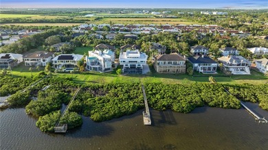 Located in the private, gated enclave of Esplanade on the Bay