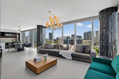 Step into a corner residence wrapped in floor-to-ceiling glass