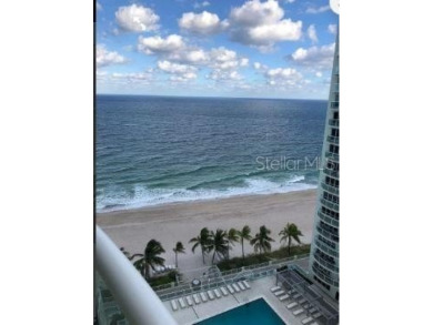 Experience luxury oceanfront living at its finest in this