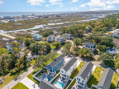 Just a quarter mile from the beach, this stunning 5-bedroom, 5