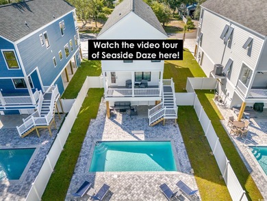 Just a quarter mile from the beach, this stunning 5-bedroom, 5