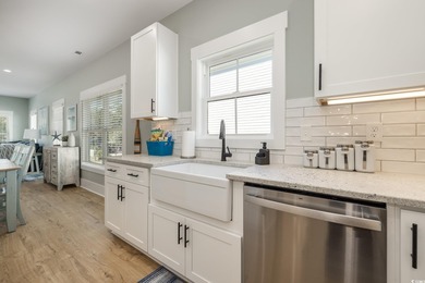 Just a quarter mile from the beach, this stunning 5-bedroom, 5